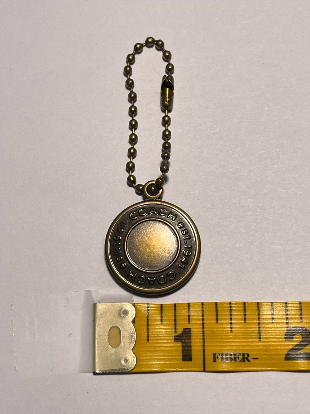 COACH Round Medallion Hang Tag